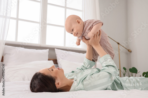 Happy mother with her littl...