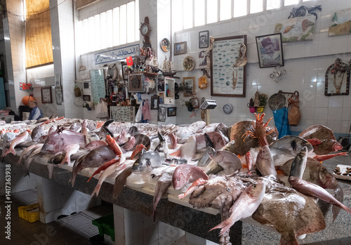 Fresh catch on display on the counter at the fish souk market in the old town medina in Tangiers Tangier Morocco.
