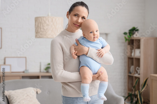 Mother hugging her little b...