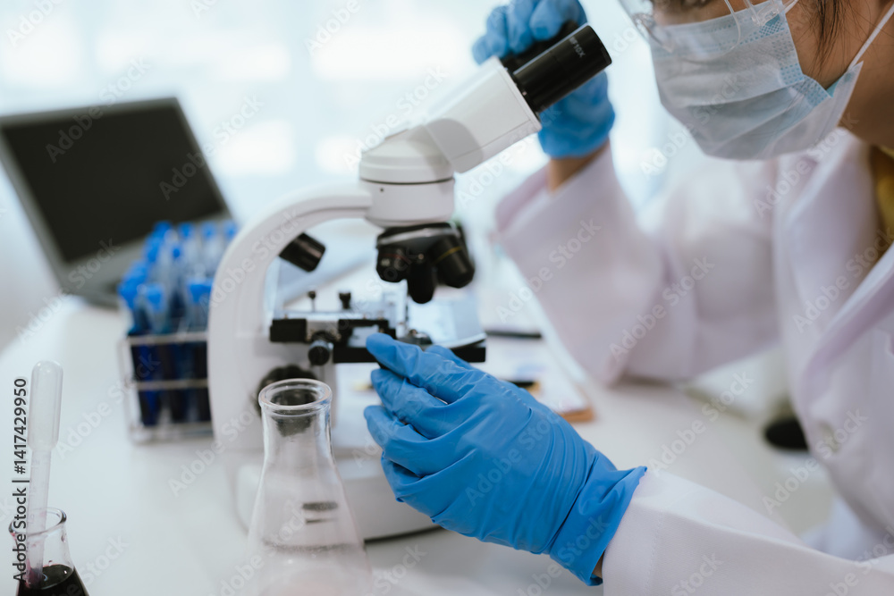 Scientist analyzes biological samples using advanced laboratory equipment for medical research, diagnosis, biotechnology development, and pharmaceutical or clinical discoveries. Scientist analyzes biological samples using advanced laboratory equipment for medical research, diagnosis, biotechnology development, and pharmaceutical or clinical discoveries.