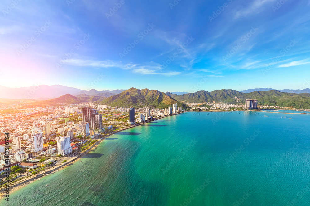 Fototapeta premium North beach overlooking aerial view city on the gold main resort coast of Southeast Asia in the hot sunny day Nha Trang