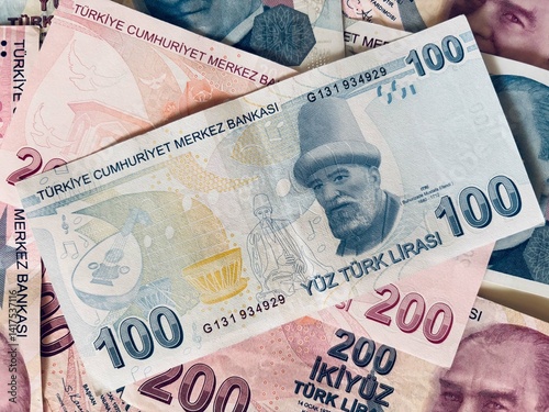 Fototapeta Naklejka Na Ścianę i Meble -  Turkish Banknotes featuring currency values of 100 and 200 Lira
