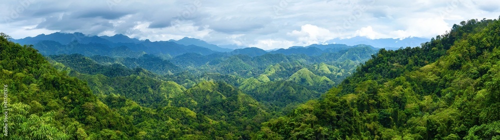 Lush Green Mountain Landscape Under Cloudy Sky in Vibrant Nature Lush Green Mountain Landscape Under Cloudy Sky in Vibrant Nature