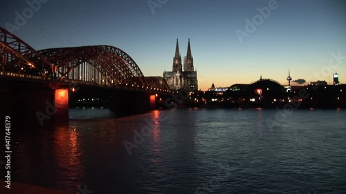 Hohenzollern Bridge Illuminated at Dusk in Time Lapse