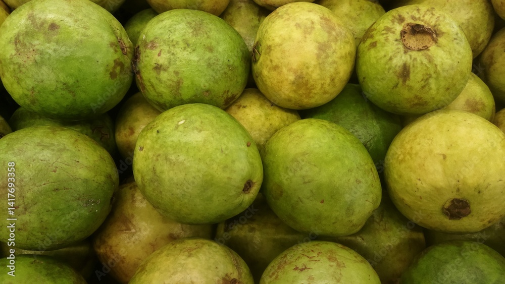 A Close-Up View of Fresh Green Guavas Ready for Consumption A Close-Up View of Fresh Green Guavas Ready for Consumption