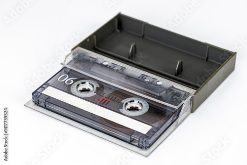 Vintage Audio Cassette: A nostalgic view of an audio cassette in its protective case. Captured in precise detail, ready for your creative needs.