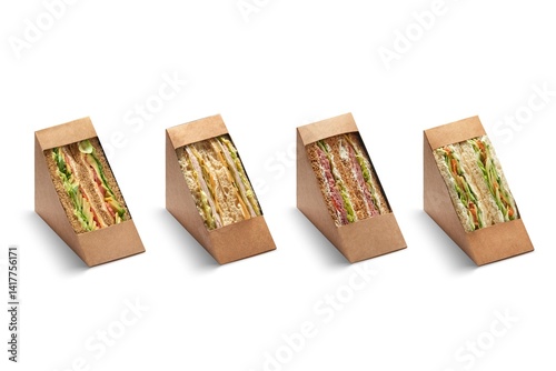 Cut club sandwich in cupboard package isolated on white background