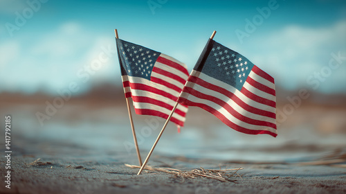 American Flags in Focus: Two small American flags stand tall, symbols of patriotism, against a soft-focus, natural backdrop evoking a sense of freedom and national pride.