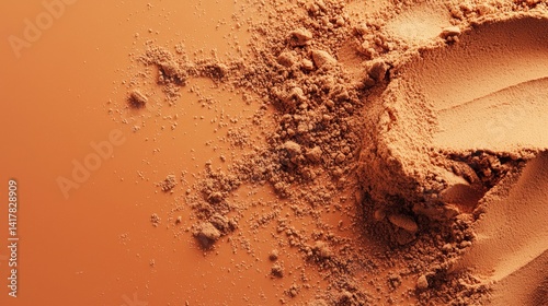 Obraz na płótnie Orange toned cocoa powder splash on minimalist background w salonie