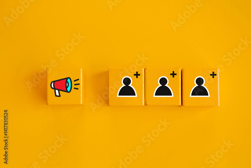 Business marketing strategies use advertisements to attract new customers ; Megaphone and people icon