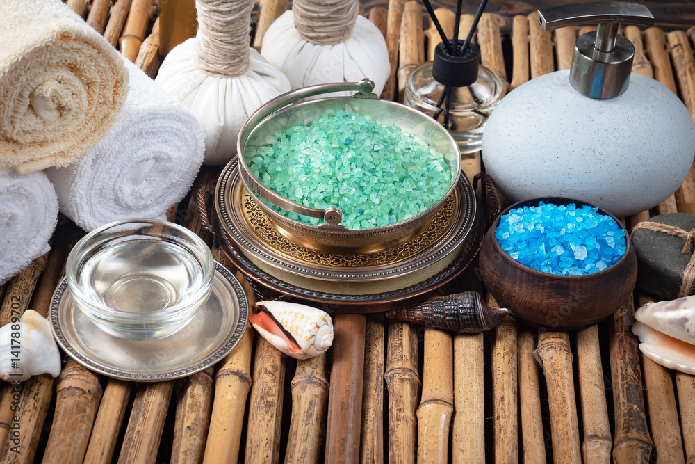 Spa treatment with candles and towel on wooden table, closeup