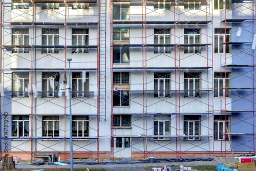 Renovation of a residential building facade demonstrates the craftsmen's skill and dedication to detail.