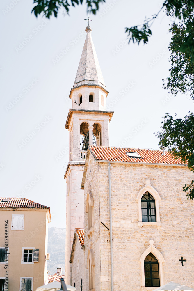 Obraz premium Tall white bell tower of St. Ivan Cathedral. Budva, Montenegro