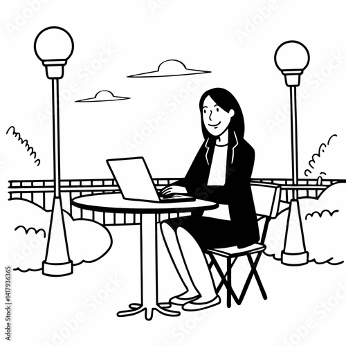 A woman sits at a table outdoors, smiling while contemplating her work on a laptop during the evening