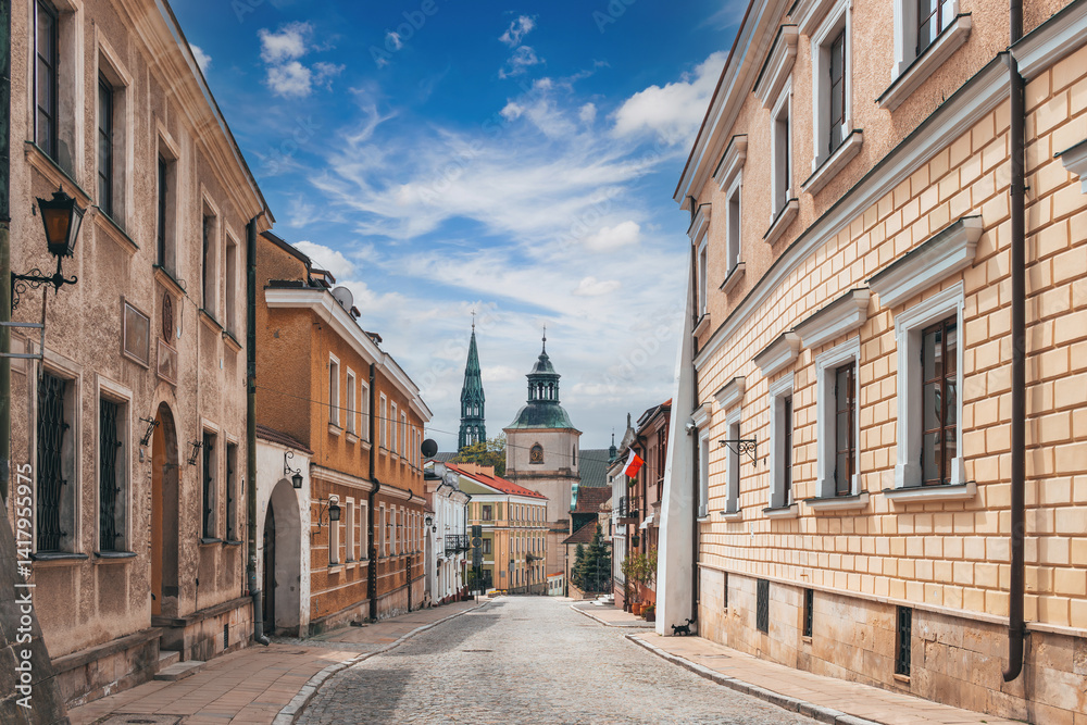 Summer cityscape of Sandomierz, Świętokrzyskie, Poland. View on city street with landmarks in the background.