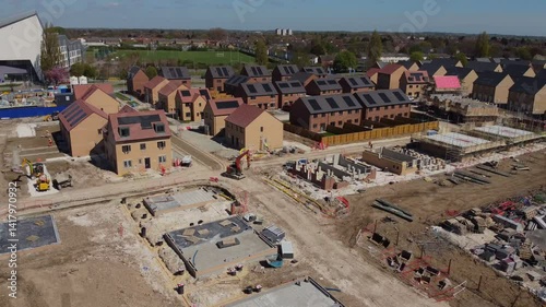 Drone 50fps. Housing development, construction site, new modern family houses. Filmed Hull. UK