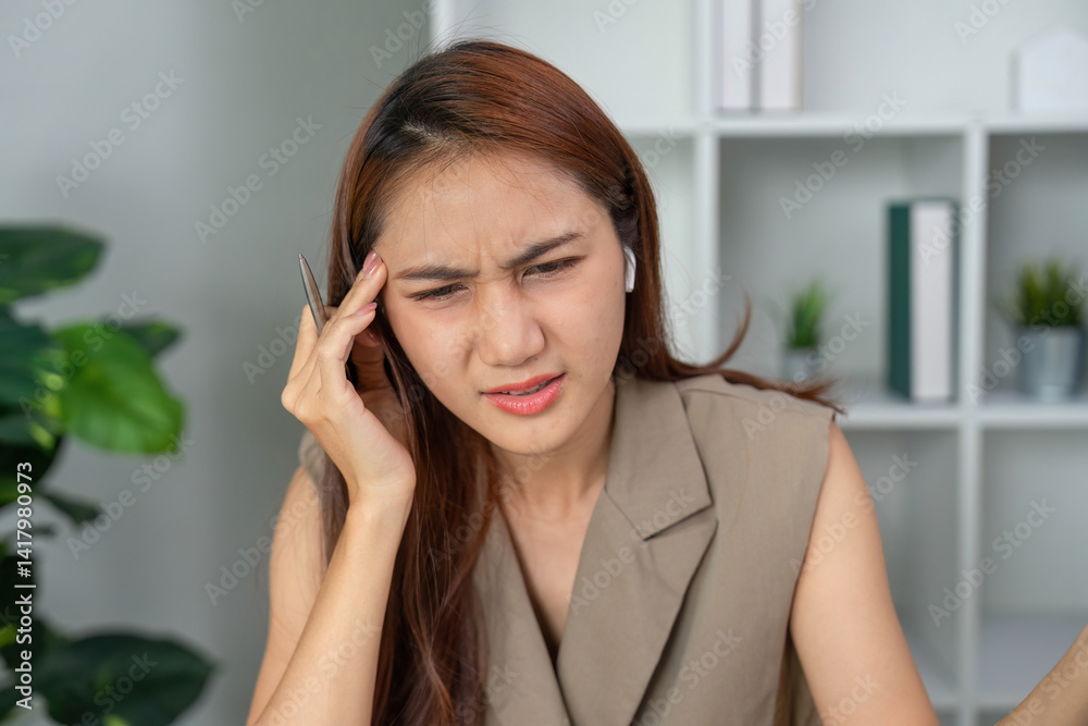 Mental Health and Concentration. A woman showing signs of frustration during her work evaluation, reflecting on her mental well-being. Mental Health and Concentration. A woman showing signs of frustration during her work evaluation, reflecting on her mental well-being.