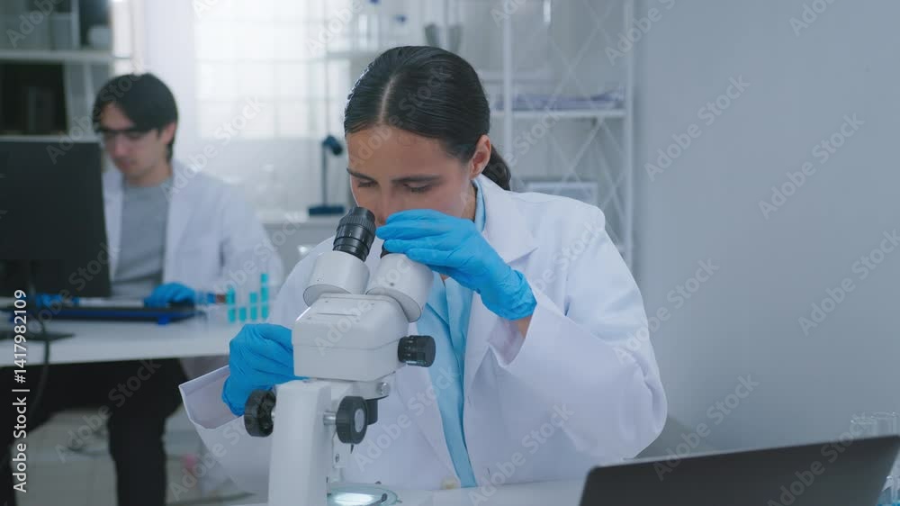 Focused Scientist and Researcher Laboratory Analyzing Samples Under Microscope for Chemistry, Biotech, Clinical Research, Experiment scientist researcher chemistry laboratory biotech, clinical Focused Scientist and Researcher Laboratory Analyzing Samples Under Microscope for Chemistry, Biotech, Clinical Research, Experiment scientist researcher chemistry laboratory biotech, clinical