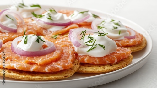 Wallpaper Mural Rakfisk, fermented trout delicately arranged on crispbread with sour cream and onion, against a white backdrop. Torontodigital.ca