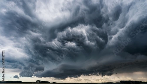 Swirling threatening gray storm clouds filling sky