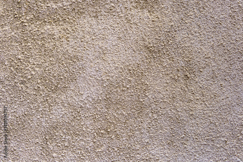 Wallpaper Mural A wall with a textured surface. The wall is tan in color. The texture is rough and uneven. Torontodigital.ca