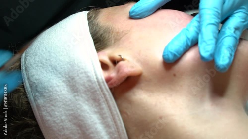 Woman getting facial at spa