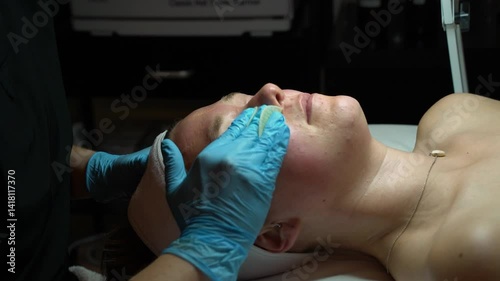 Woman getting facial at spa