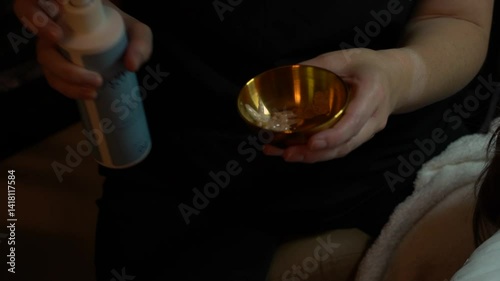 Woman getting facial at spa