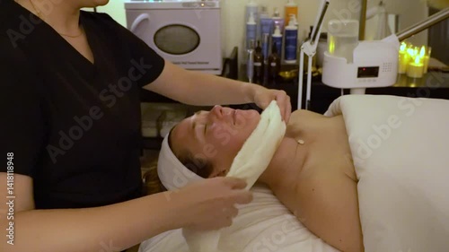 Woman getting facial at spa