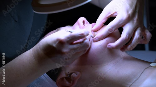 Woman getting facial at spa