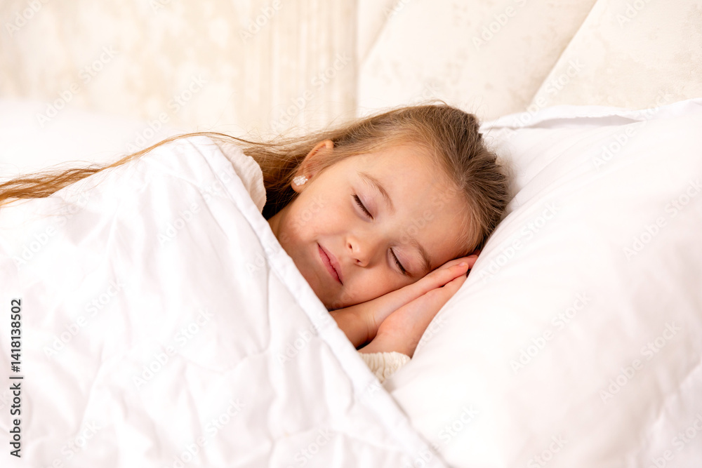 Cute little girl sleeping in bed. Little blonde girl sleeps sweetly in bed with white linen. space for text. healthy baby's sleep. High quality photo