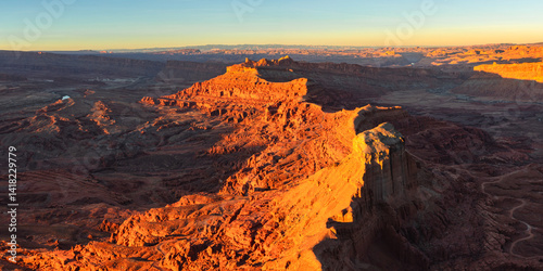 Panorama of sunset on the rugged canyon desert topography from the Anticline overlook south of Moab Utah.