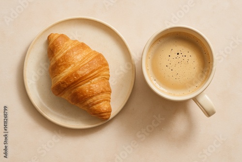 Warm Croissant and Coffee on a Simple Plate for a Delightful Breakfast Moment