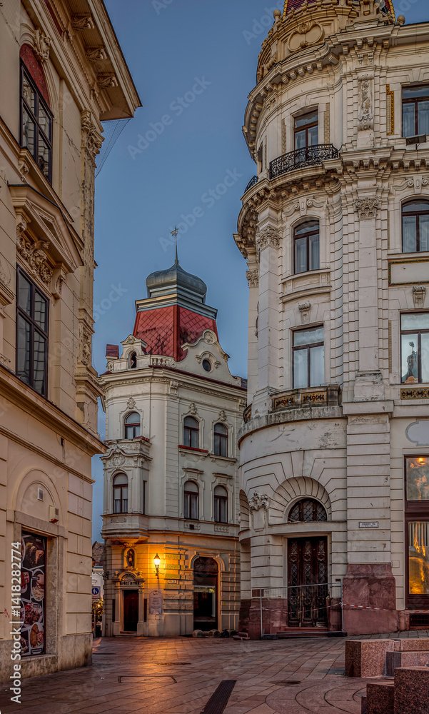 Obraz premium Alleystreet during twilight hour in Pécs, Hungary