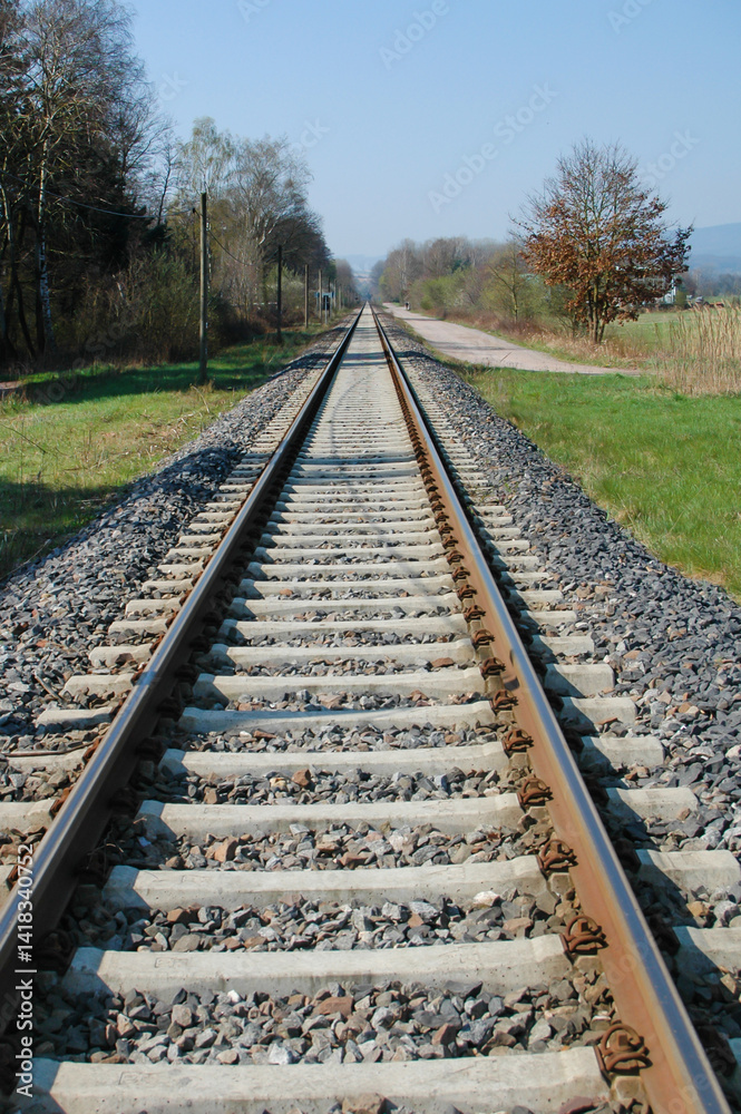 Railway Tracks Stretching Into a Clear Blue Sky Railway Tracks Stretching Into a Clear Blue Sky