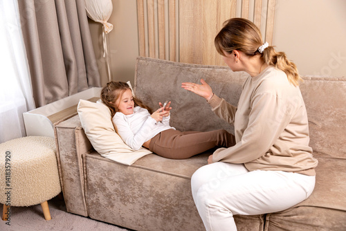 Digital detox. Mother taking smartphone from her angry little child girl. Children gadget dependence, technology internet addiction. Parental control, upbringing concept.