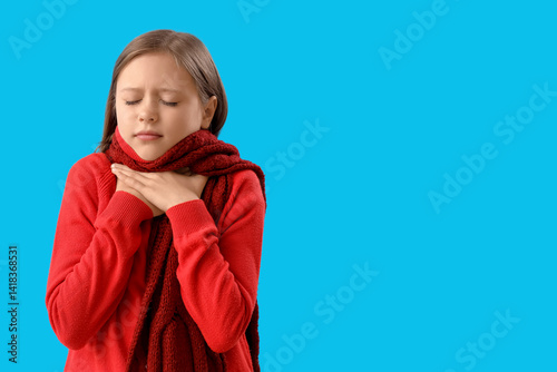 Ill little girl on blue bac...