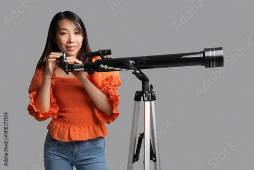 Young Asian woman using tel...