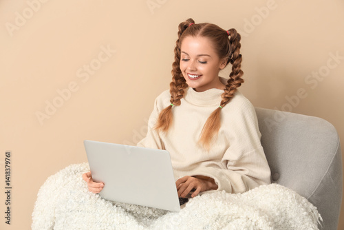 Happy young woman in warm s...