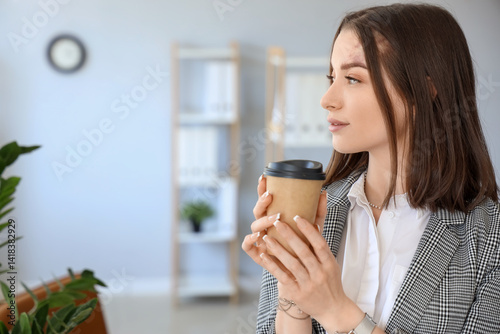Young businesswoman with cu...