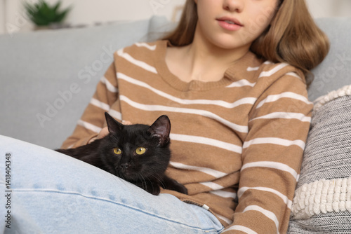 Woman with cute black cat s...