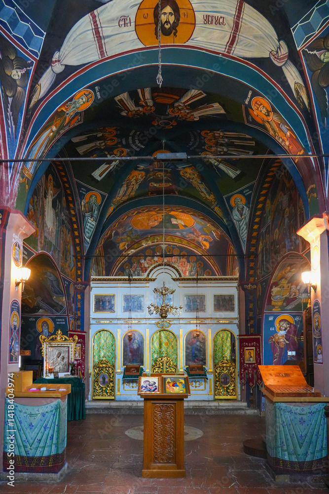 Interior of the Reževići Monastery in Montenegro - Church of the Dormition of the Mother of God of the Serbian orthodox church with vaulted ceilings and painted walls