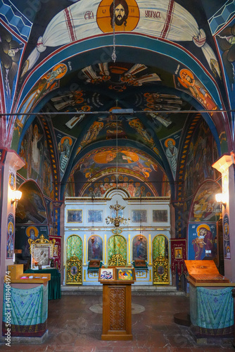 Obraz na płótnie Interior of the Reževići Monastery in Montenegro - Church of the Dormition of the Mother of God of the Serbian orthodox church with vaulted ceilings and painted walls w salonie