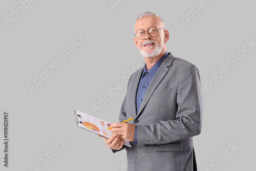Senior businessman holding ...
