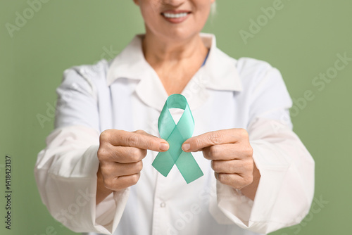 Mature female doctor with t...