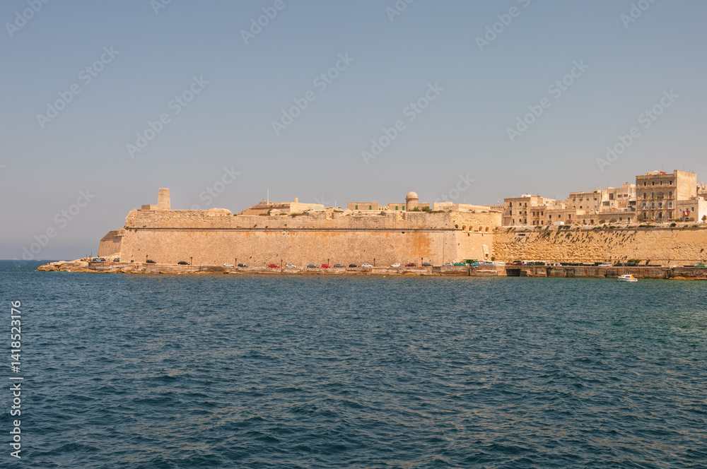 A beautiful blue ocean with a castle in the background A beautiful blue ocean with a castle in the background