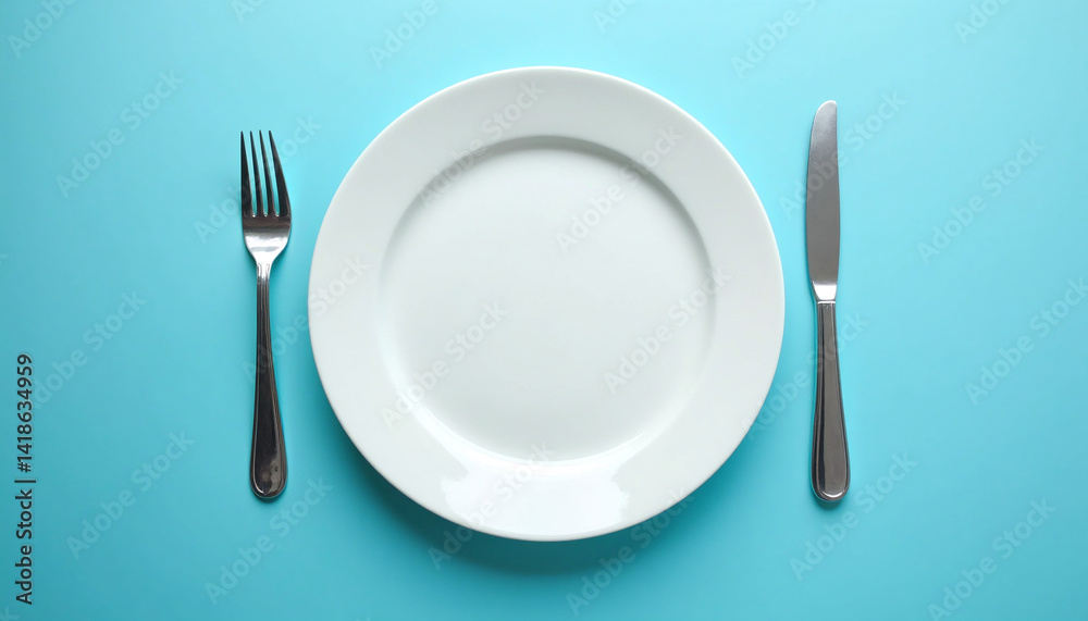 A white plate with a fork and knife on a blue background. A white plate with a fork and knife on a blue background.