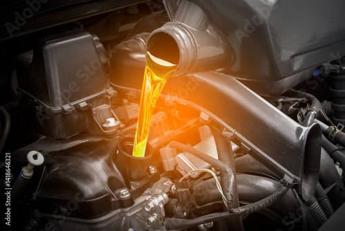 Obraz na płótnie Refueling and pouring oil quality into the engine motor car Transmission and Maintenance Gear .Energy fuel concept.
w salonie
