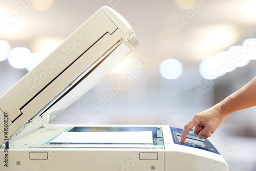 Businessman use photocopy or copier or photocopier in office workplace is equipment for copy duplicate Xerox or scanner to scanning document or printer for printing paper.