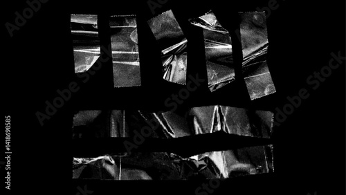 Crumpled Plastic Transparent Sticky Tape / Isolated on Black Background